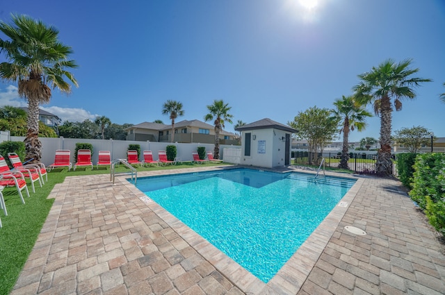 pool featuring a patio area and fence private yard