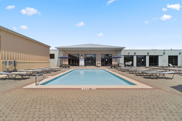 community pool featuring a patio area