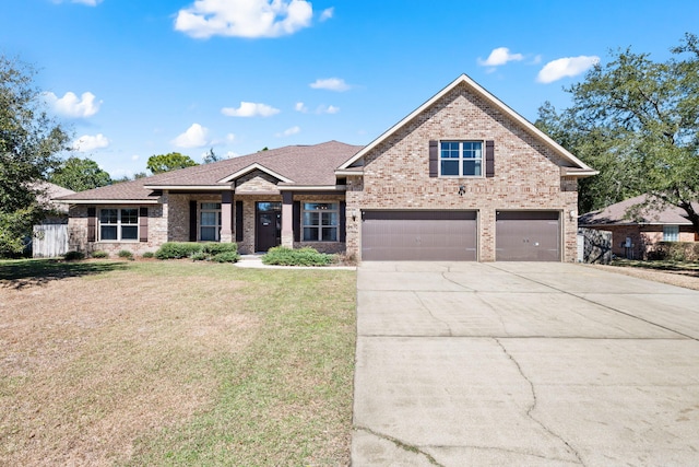 view of front facade featuring brick siding, roof with shingles, concrete driveway, an attached garage, and a front yard