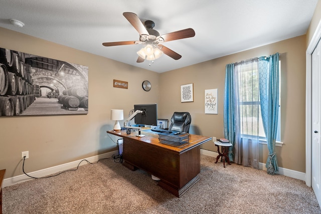 office with carpet floors, ceiling fan, and baseboards