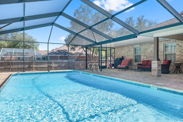 view of swimming pool featuring a fenced in pool, a lanai, and a patio