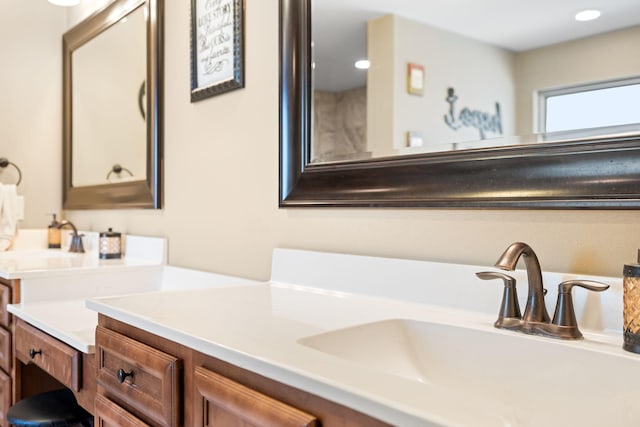 bathroom featuring vanity and recessed lighting