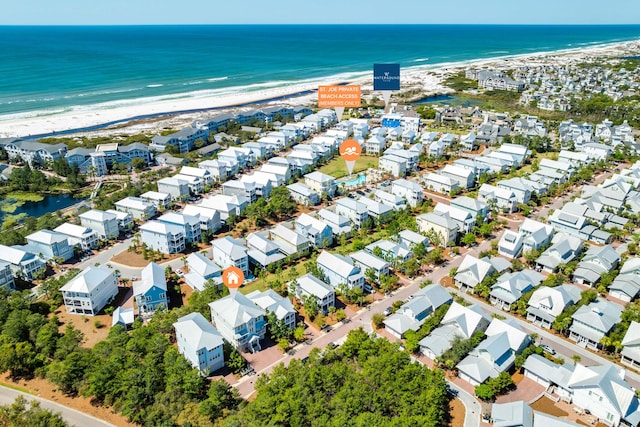 bird's eye view featuring a water view, a residential view, and a view of the beach