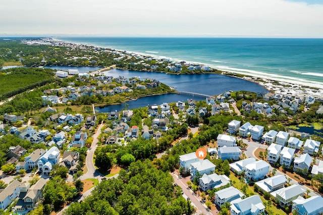 drone / aerial view featuring a residential view and a water view