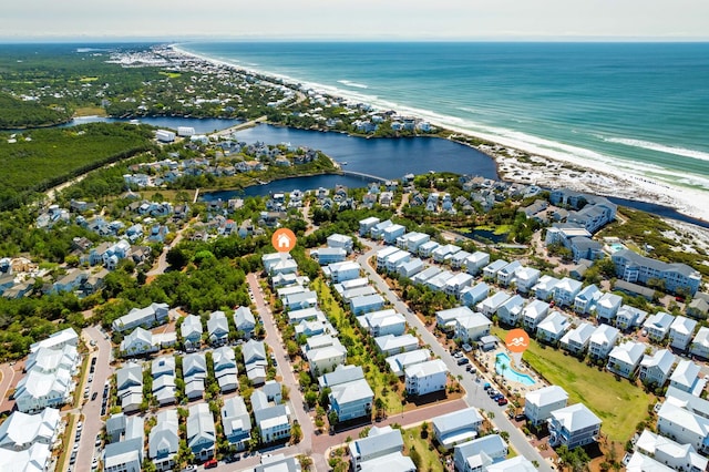 drone / aerial view featuring a water view and a residential view