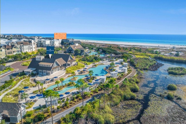 bird's eye view with a water view and a view of the beach