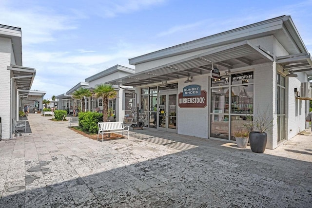 view of property's community with a patio area