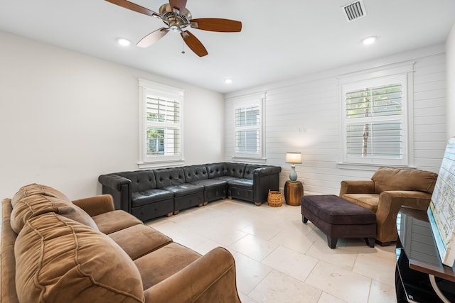 living room with recessed lighting, visible vents, and a ceiling fan