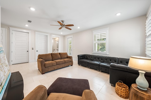 living room featuring ceiling fan, baseboards, visible vents, and recessed lighting