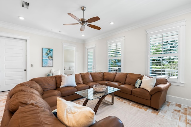 living area featuring ceiling fan, recessed lighting, visible vents, baseboards, and crown molding