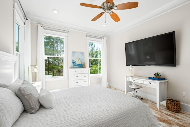 bedroom featuring baseboards, recessed lighting, wood finished floors, and crown molding