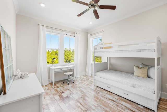 bedroom featuring baseboards, ceiling fan, ornamental molding, wood finished floors, and recessed lighting