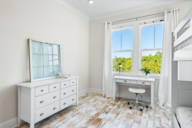 office featuring baseboards, ornamental molding, and wood finished floors