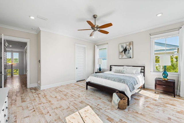 bedroom with baseboards, multiple windows, wood finished floors, and crown molding