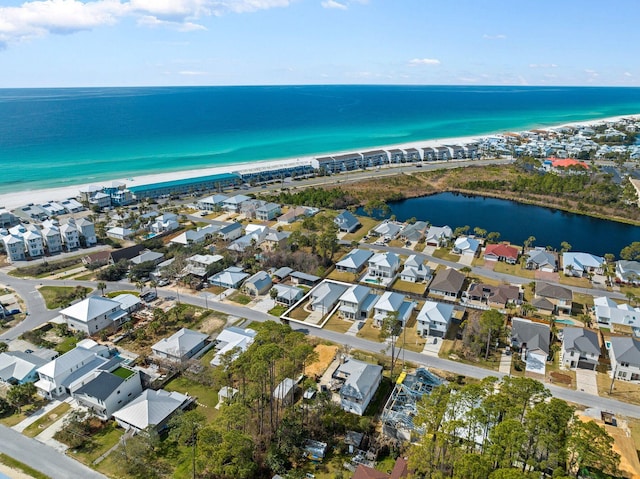 birds eye view of property featuring a water view and a residential view