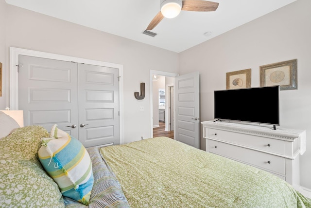 bedroom featuring a closet, visible vents, and a ceiling fan