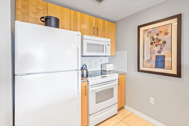 kitchen featuring white appliances, baseboards, light tile patterned flooring, decorative backsplash, and light countertops