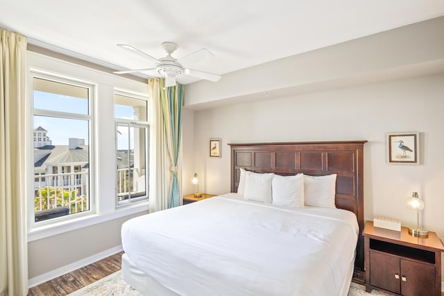 bedroom with a ceiling fan, baseboards, and light wood finished floors