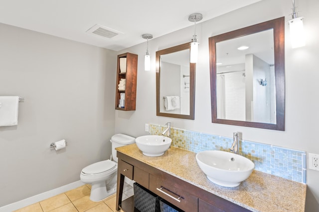 full bathroom featuring tile patterned floors, tasteful backsplash, visible vents, and a sink