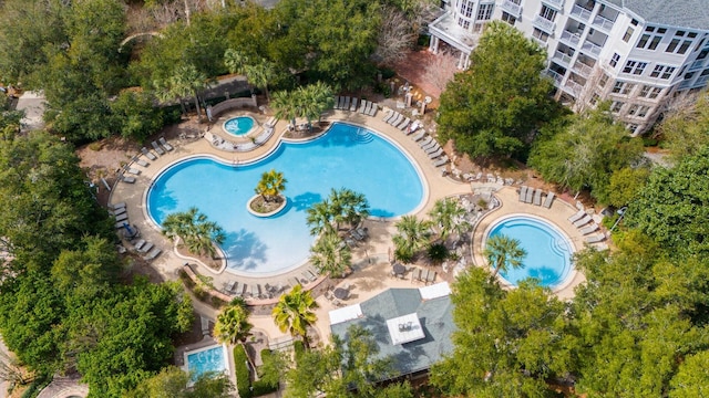 view of pool with a hot tub