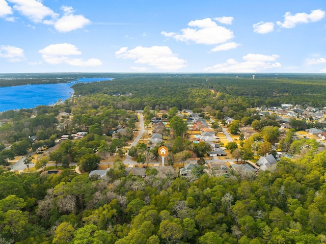 aerial view featuring a water view and a wooded view