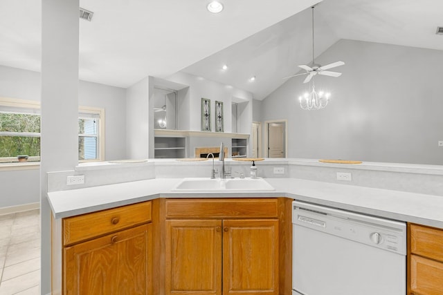 kitchen featuring a sink, light countertops, dishwasher, and lofted ceiling