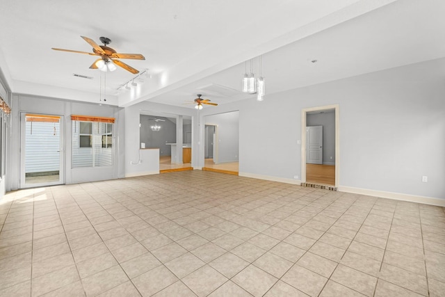 unfurnished living room with visible vents, baseboards, and ceiling fan with notable chandelier