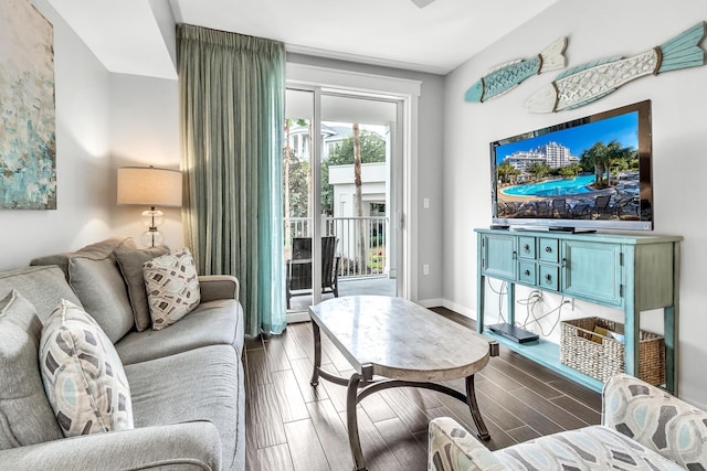 living room with wood finish floors and baseboards