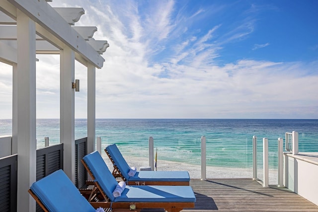 exterior space featuring a water view and a view of the beach