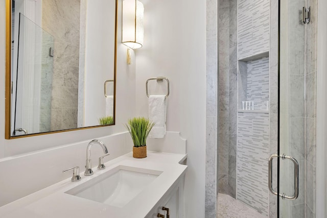 bathroom featuring a stall shower and vanity