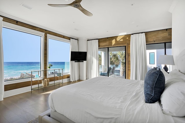 bedroom featuring access to exterior, ceiling fan, visible vents, and wood finished floors