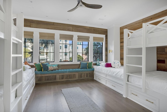 unfurnished bedroom featuring ornamental molding and wood-type flooring