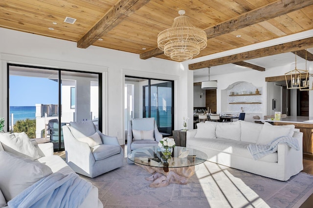 living room featuring beamed ceiling, wooden ceiling, visible vents, and an inviting chandelier