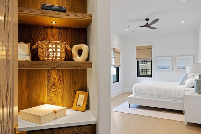 bedroom with recessed lighting, ornamental molding, a ceiling fan, wood finished floors, and baseboards