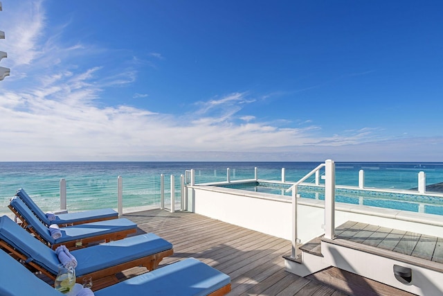 wooden deck featuring a water view