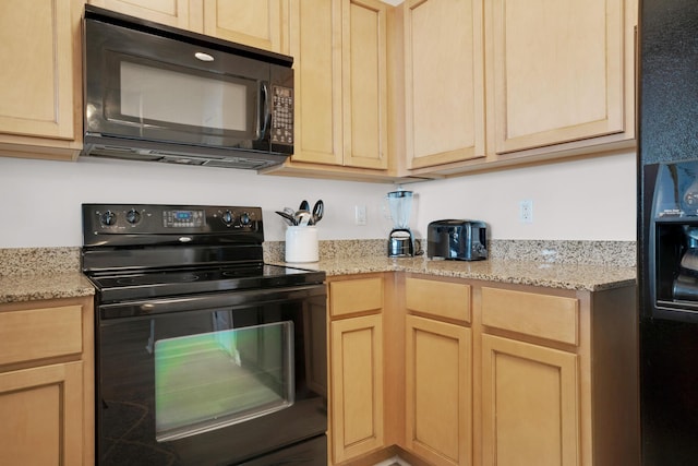 kitchen with black appliances and light brown cabinets