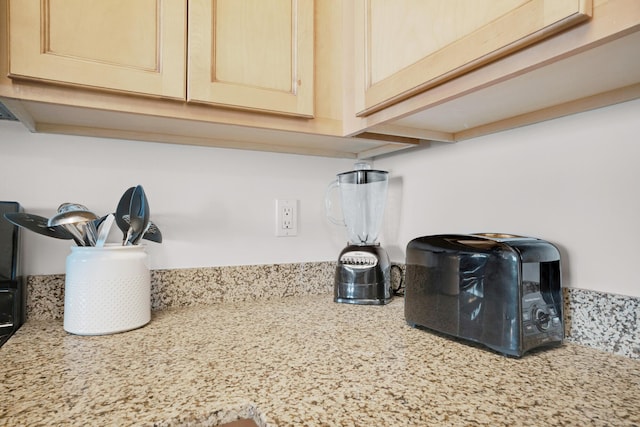 details featuring light stone countertops