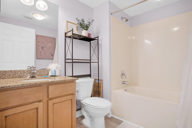 full bath with toilet, wood finished floors, vanity, visible vents, and shower / bath combination with curtain