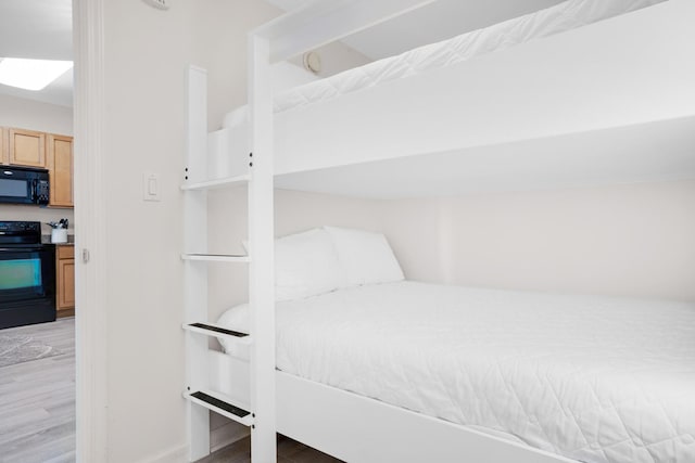 bedroom with light wood finished floors