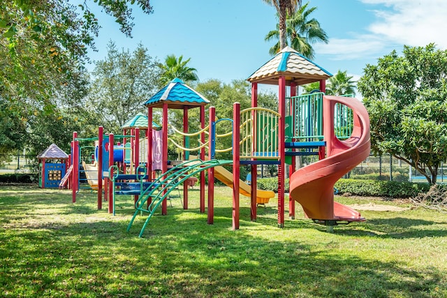 community playground featuring a lawn