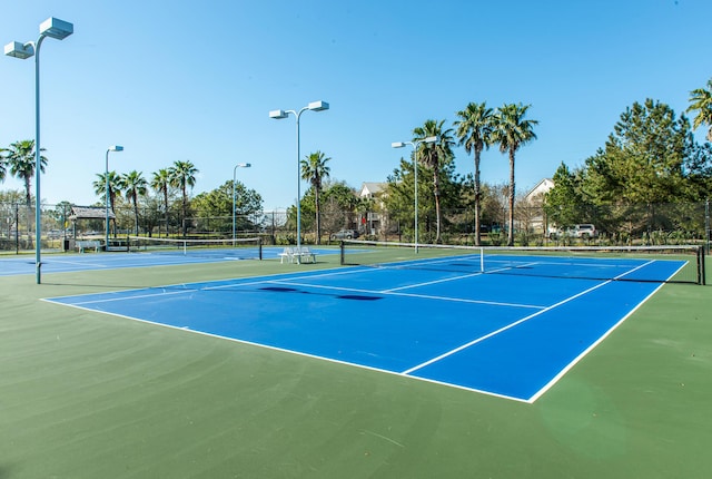 view of sport court with fence