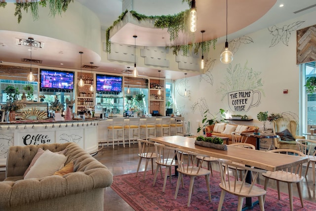 dining area with a dry bar and visible vents