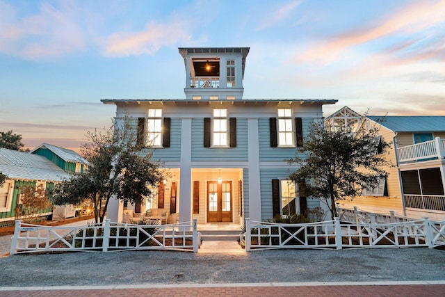 35 Tupelo St, Santa Rosa Beach, FL 32459 - view of front of house with french doors and fence private yard