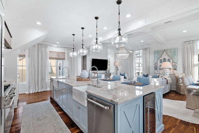 35 Tupelo St, Santa Rosa Beach, FL 32459 - kitchen featuring appliances with stainless steel finishes, a sink, open floor plan, wine cooler, and a center island with sink
