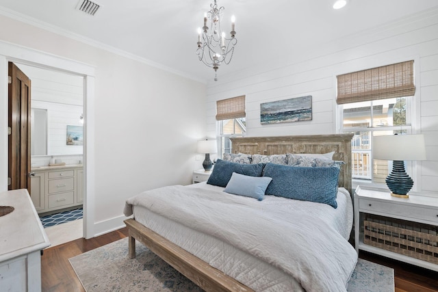 35 Tupelo St, Santa Rosa Beach, FL 32459 - bedroom featuring an inviting chandelier, ornamental molding, ensuite bathroom, visible vents, and dark wood-style floors