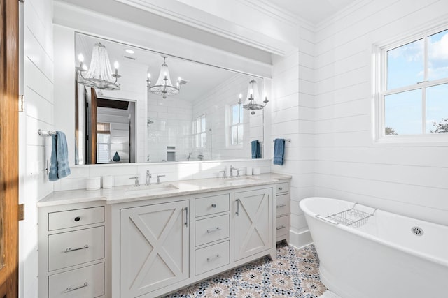 35 Tupelo St, Santa Rosa Beach, FL 32459 - full bath with a sink, tiled shower, double vanity, and a notable chandelier