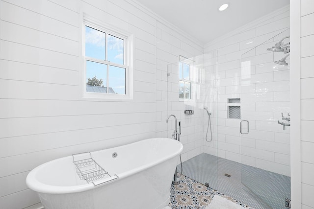 35 Tupelo St, Santa Rosa Beach, FL 32459 - full bath featuring tile patterned flooring, ornamental molding, recessed lighting, a soaking tub, and a shower stall