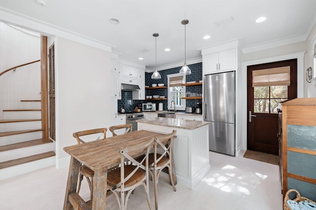 35 Tupelo St, Santa Rosa Beach, FL 32459 - kitchen with open shelves, white cabinets, a sink, appliances with stainless steel finishes, and backsplash