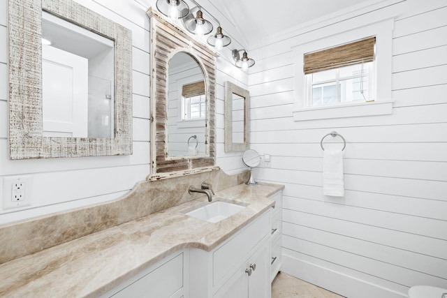 35 Tupelo St, Santa Rosa Beach, FL 32459 - bathroom featuring vanity, plenty of natural light, and wood walls