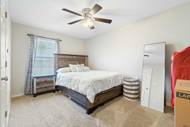 bedroom with baseboards and ceiling fan